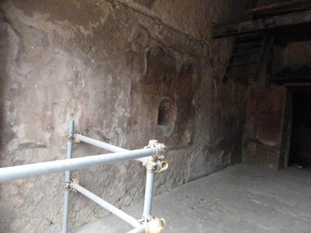 Ins. Orientalis II.9, Herculaneum. September 2015. North wall of shop, with niche and remains of the fresco.
