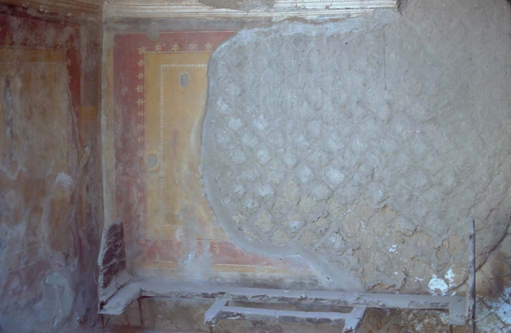 Ins. Or. II.09, Herculaneum. 7th August 1976. Looking north-east in rear room with remains of painted decoration, and carbonised wooden bed.
Photo courtesy of Rick Bauer, from Dr George Fay’s slides collection.