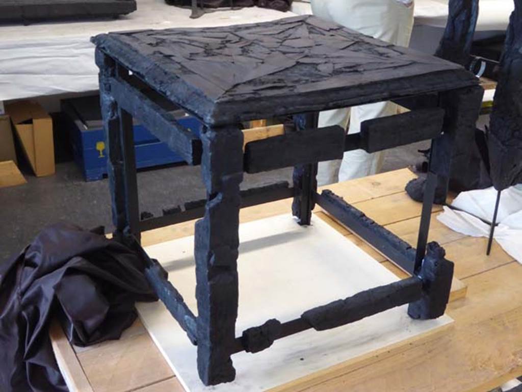 Ins. Orientalis II.10, Herculaneum. September 2016. Small wooden stool/table with inlaid top.
Photo courtesy of Michael Binns.
This table has also been entered into the pages for VI.29 (pt 4, including other sides of the stool/table), as there is some confusion as to its provenance/location where found.
See De Carolis, E. (2007). Il mobile a Pompei ed Ercolano: letti tavoli sedie e armadi. Rome, “L’ERMA” di Bretschneider, (p.125, fig.88).
According to Wallace-Hadrill, “the wooden stool was from the house opposite” (opposite to Ins.Or.II.10).
See Wallace-Hadrill, A. (2011). Herculaneum, Past and Future. London, Frances Lincoln Ltd., (p.278).
A photo of the room prepared by Maiuri, taken in 1957, shows the top of the stool/table.
See Camardo, D. & Notomista,M. (2017). Ercolano: 1927-1961. Rome, “L’ERMA” de Bretschneider, (Scheda 50, p.273-274).
