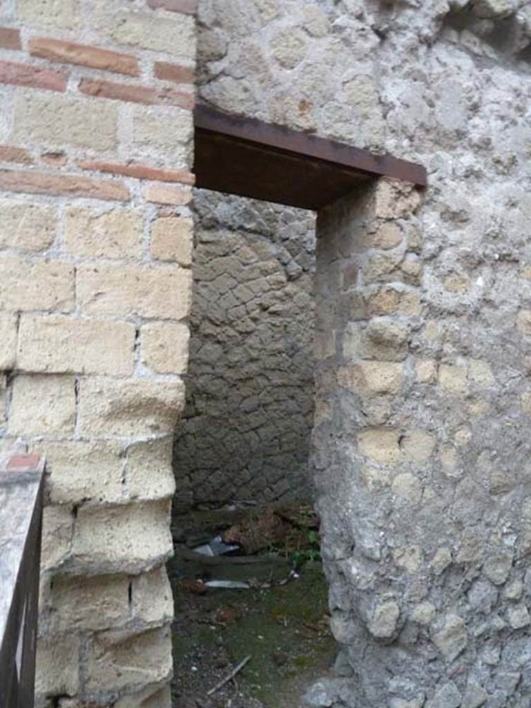Ins. Orientalis II.12, Herculaneum. September 2015.
Doorway to latrine on the west end of the north wall.
Maiuri suggested that this may have been a public latrine, and the urine collected to be used in a fullonica.
