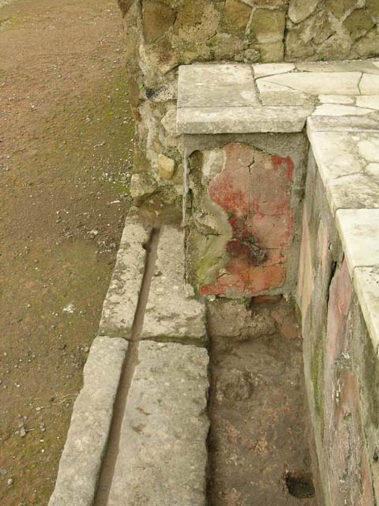 Ins Or II. 13, Herculaneum. December 2004. North end of counter and threshold of doorway.
Photo courtesy of Nicolas Monteix.