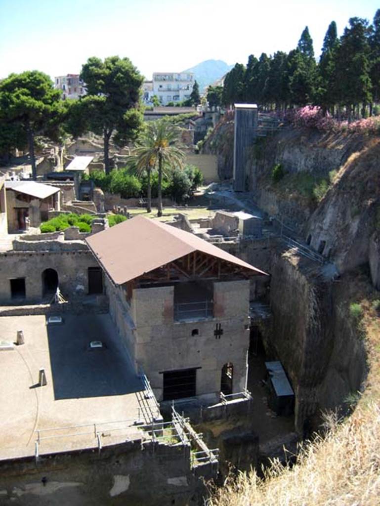 Herculaneum, June 2011. Looking north from access roadway towards the “tower” room of the House of Relief of Telephus, in centre. Note Vesuvius peeking over the site, centre top.  Photo courtesy of Sera Baker.

