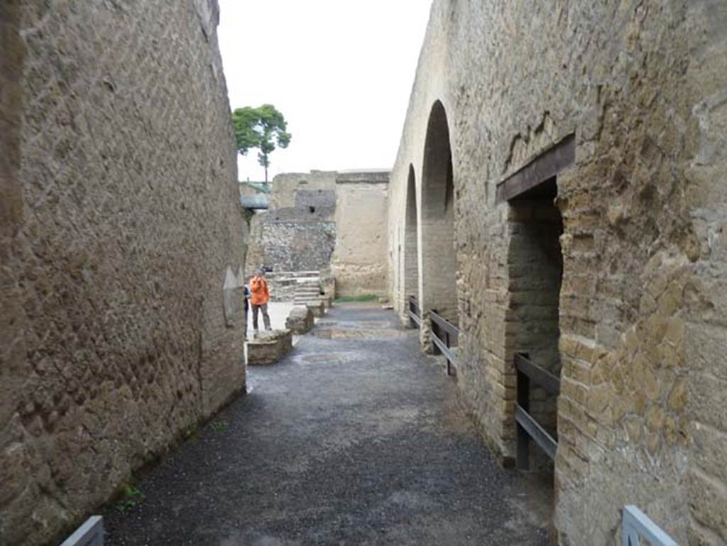 Herculaneum, September 2015. Looking west towards the Sacred Area. The Sacred Area was a large terrace with buildings for worship, which are the chapel of Venus, and the chapel of the four gods. Under this terrace, were six of the twelve arches of the beachfront boatsheds, in which many of the skeletons of the fugitives have been found.