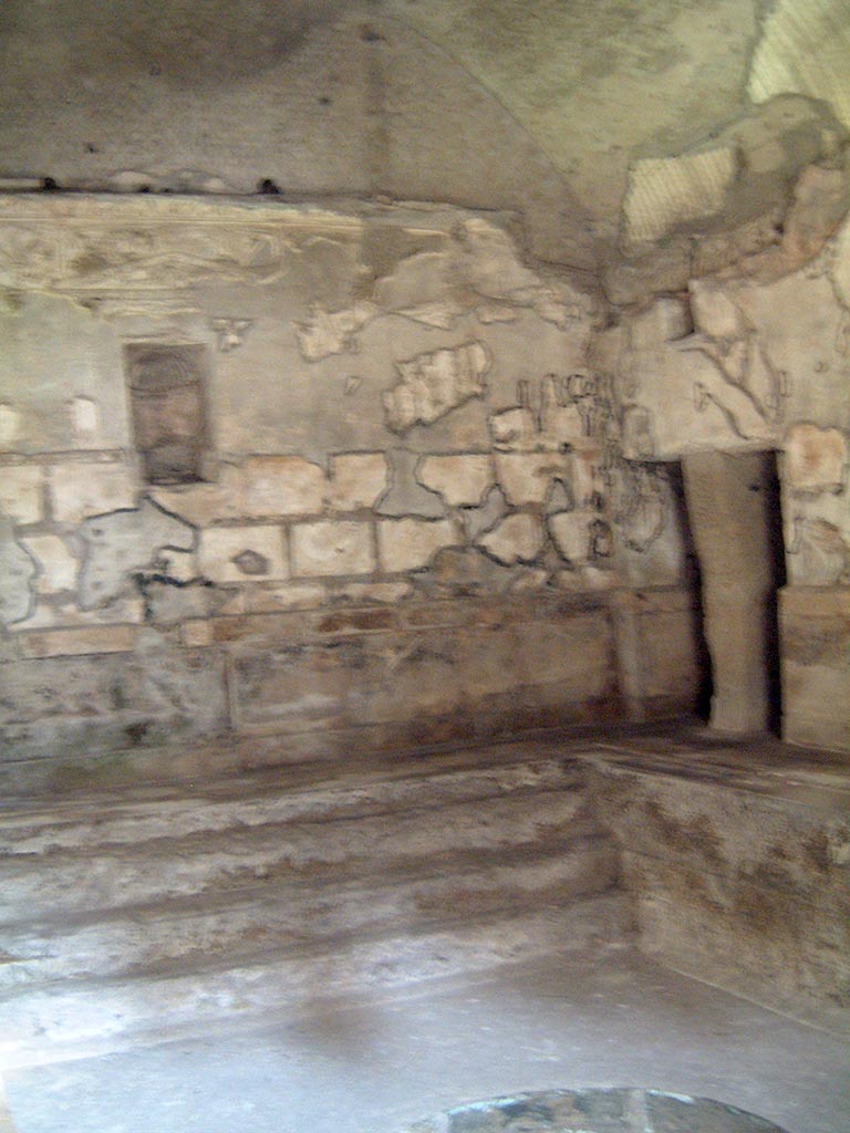 Herculaneum, May 2001.
Looking towards west wall and north-west corner, with steps at west end of hot pool in the second larger caldarium.
Photo courtesy of Current Archaeology.