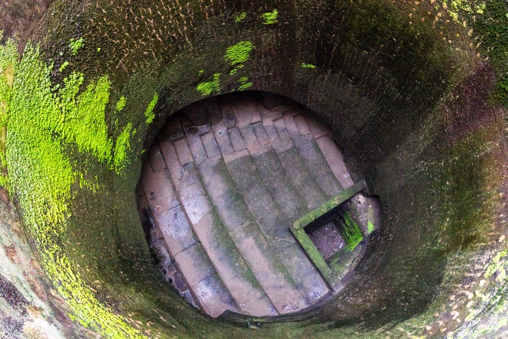 Herculaneum Theatre. October 2023. Looking down access shaft onto seating and steps. Photo courtesy of Johannes Eber.