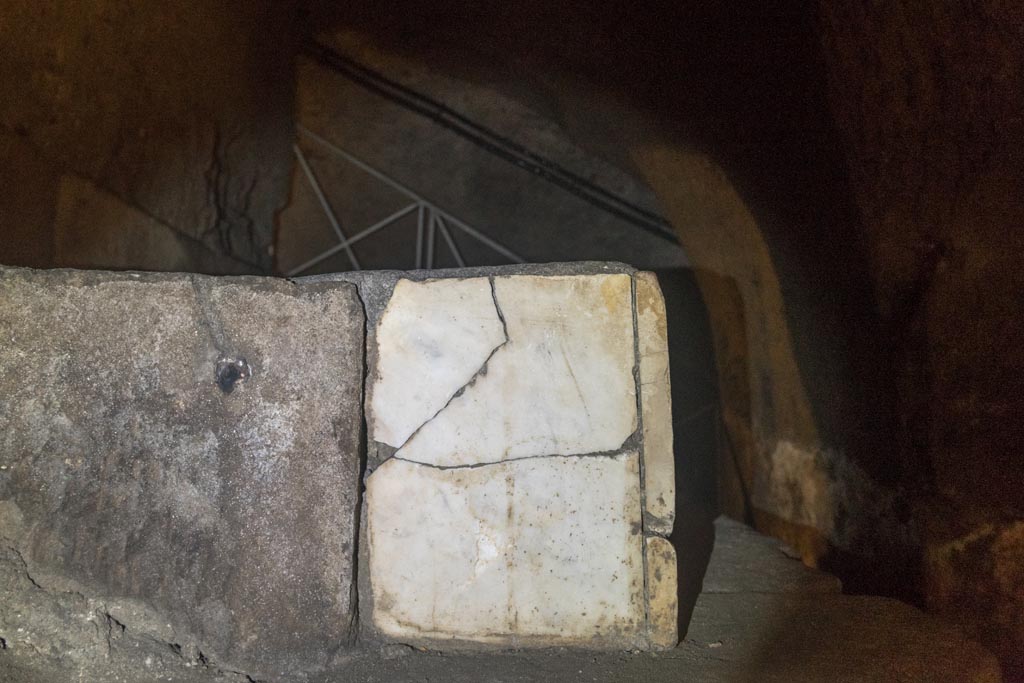 Herculaneum Theatre. October 2023. Side of marble base with copy of inscription to M. Nonio M F Balbo, in situ underground.
Photo courtesy of Johannes Eber.