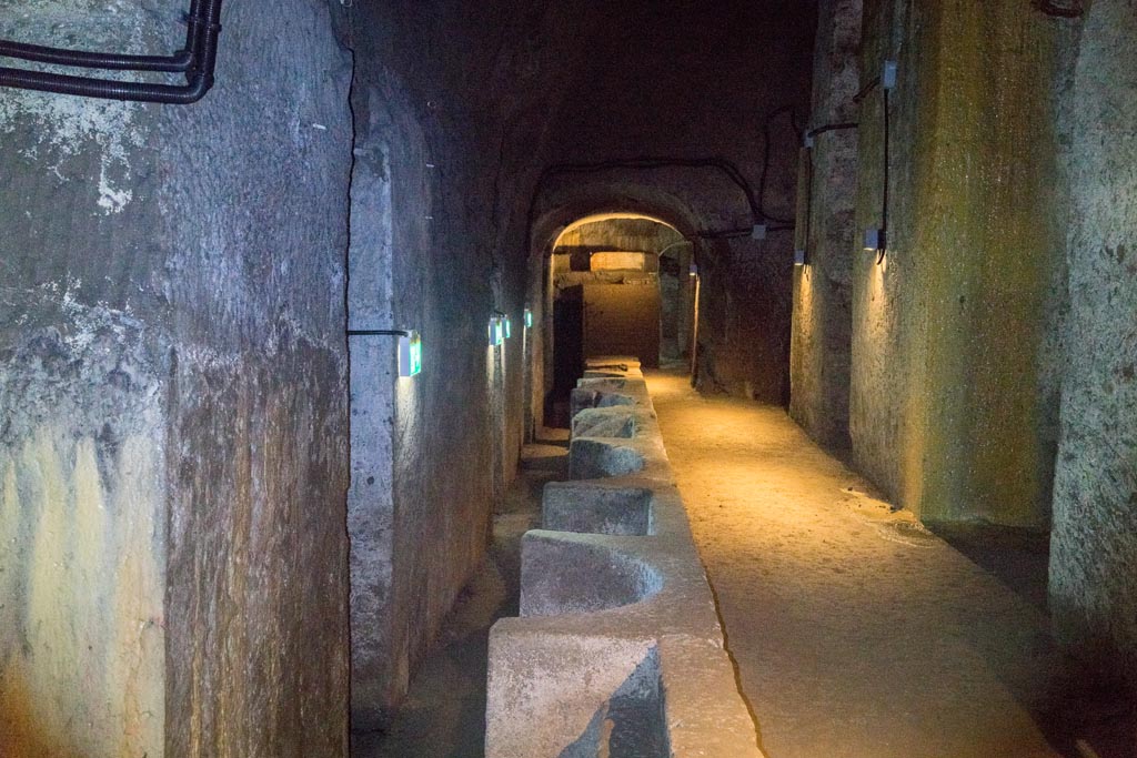 Herculaneum Theatre. October 2023.
Looking across proscenium towards base with honorary inscription, at far end. Photo courtesy of Johannes Eber.