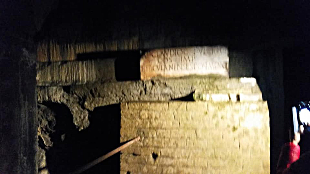 Herculaneum Theatre, photo taken between October 2014 and November 2019.
Copy of inscription to AP Claudio C F Pulchro after his death, in situ underground. Photo courtesy of Giuseppe Ciaramella.