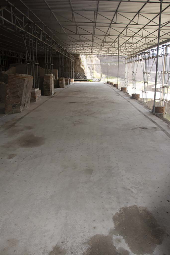 Villa dei Papiri, March 2019. 
Looking east across walkway (a), the large loggia, with white and black mosaic floor.
Foto Annette Haug, ERC Grant 681269 DÉCOR.

