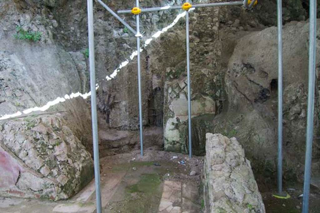 House of Dionysiac Reliefs, Herculaneum. July 2010.
Room (m), south-east corner with doorway leading to room (t), not fully excavated.
Photo courtesy of Michael Binns.