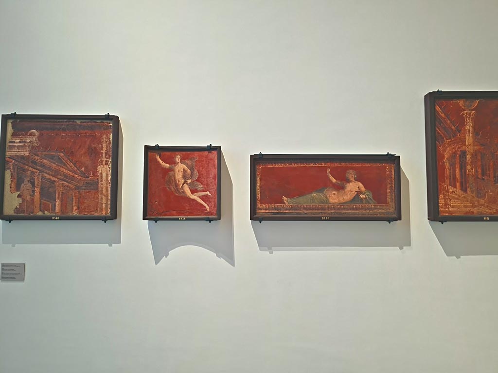 Herculaneum Augusteum. April 2023. 
Paintings on wall to the left of Arch, inv. 8540, on left, 8828, 9290 and 9931, on right. Photo courtesy of Giuseppe Ciaramella.
