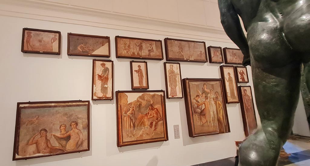 Herculaneum Augusteum. April 2023. Paintings on side wall. 
On display in “Campania Romana” gallery in Naples Archaeological Museum.  Photo courtesy of Giuseppe Ciaramella.
