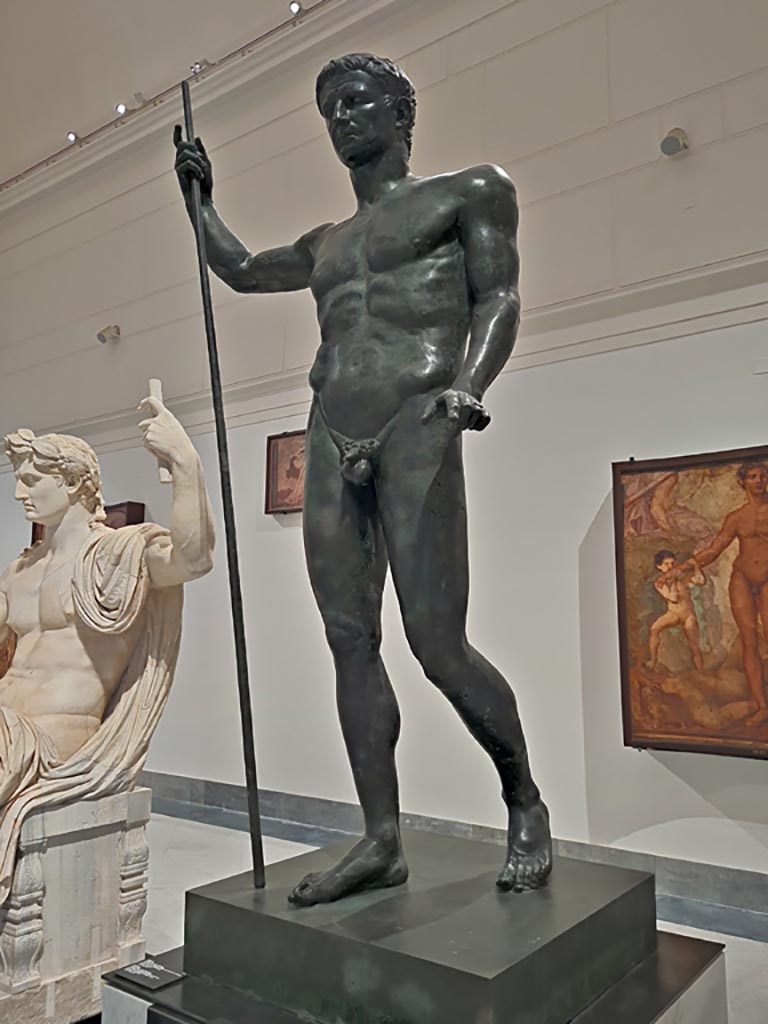 Herculaneum Augusteum. April 2023. 
Detail of bronze statue of Claudius, inv. 5593. Photo courtesy of Giuseppe Ciaramella.
