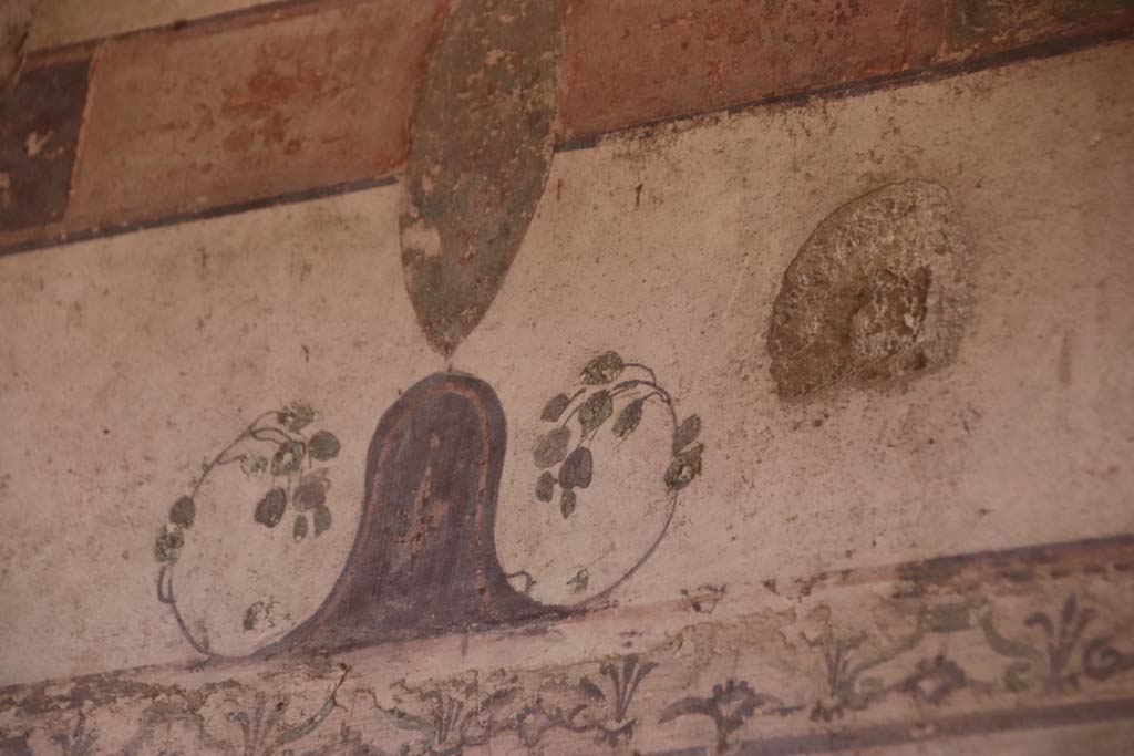 III.11 Herculaneum, October 2020. Room 2, detail of painted decoration from upper south wall. Photo courtesy of Klaus Heese.