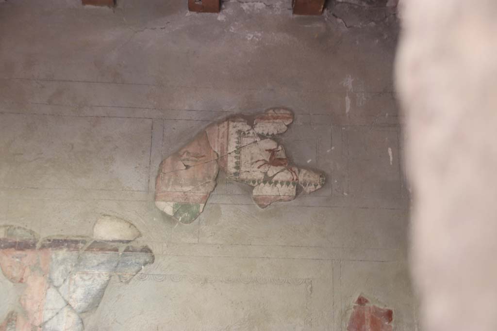 III.11 Herculaneum. October 2020. Room 4, remains of painted frieze at west end of upper south wall. Photo courtesy of Klaus Heese.