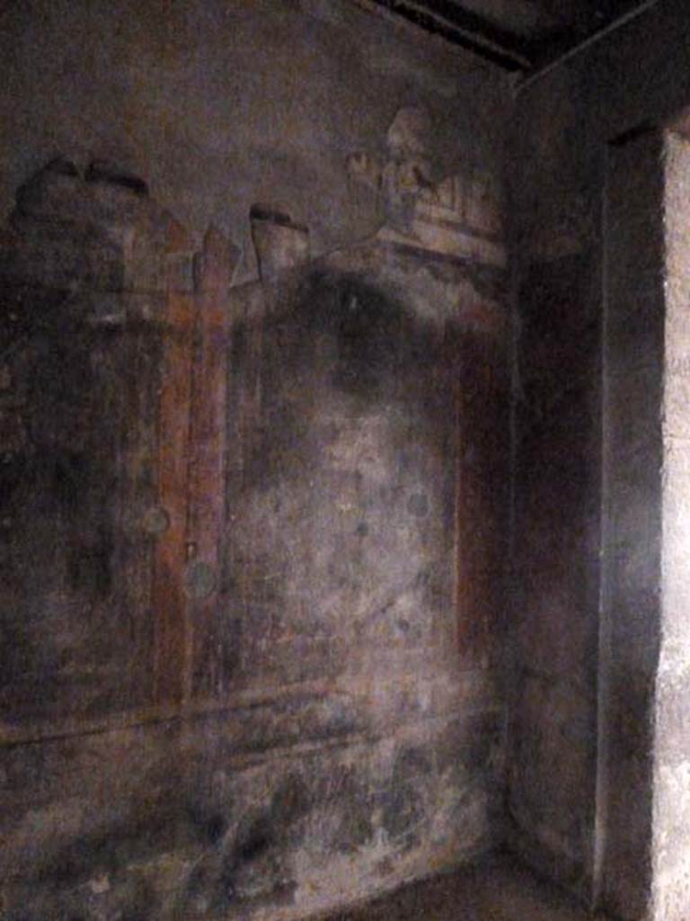 III.11 Herculaneum. May 2010. Room 4, west wall in north-west corner, with doorway in north wall to atrium. 
