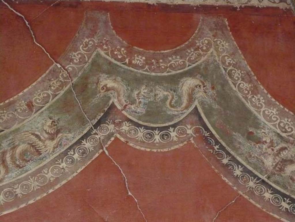 III.11 Herculaneum. August 2013. Room 8, detail from upper east wall with sea-monsters and dolphins.  Photo courtesy of Buzz Ferebee.
