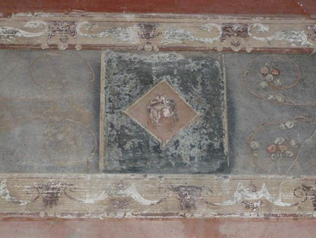 III.11 Herculaneum. August 2013.  Room 8, painted detail from east wall in south-east corner. 
Photo courtesy of Buzz Ferebee.
