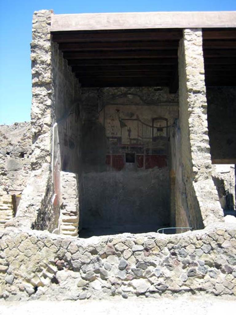 IV.15/16, Herculaneum, June 2011. Looking west from Cardo V, across house wall into room (9). Photo courtesy of Sera Baker.
