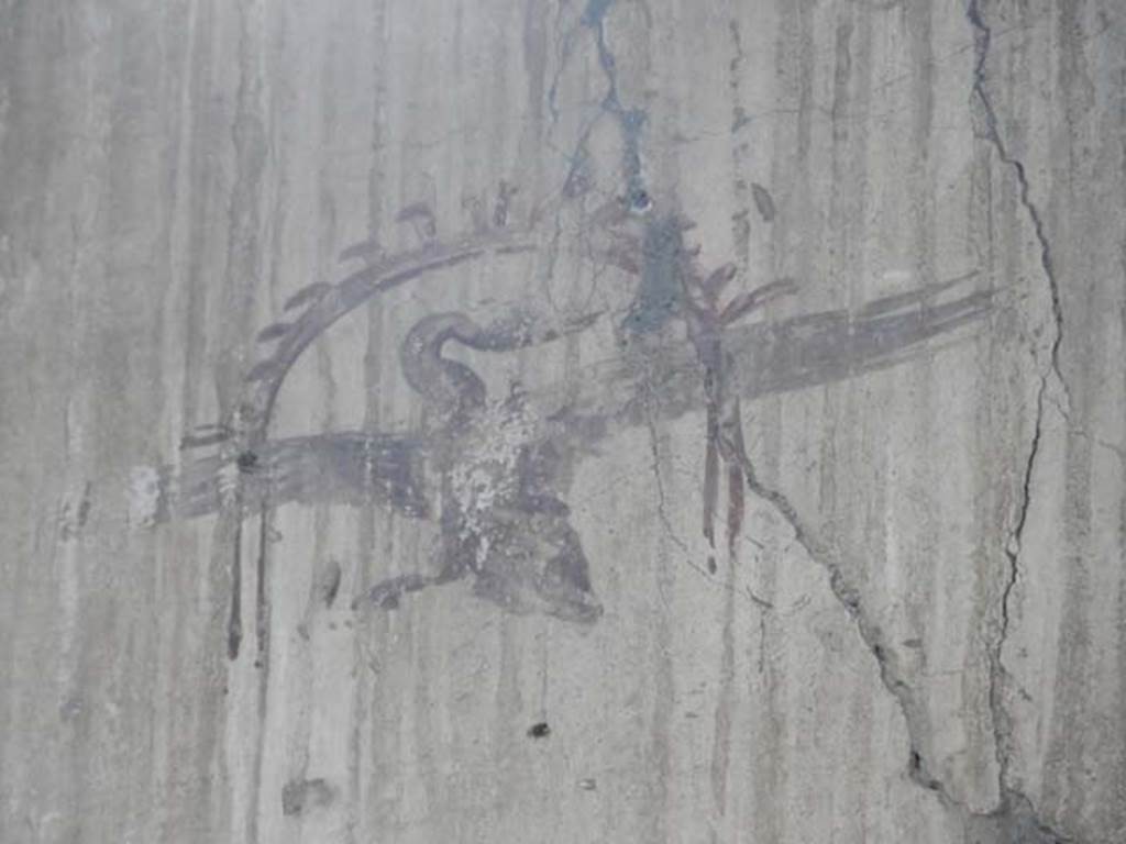 IV.21, Herculaneum. May 2018. Room 6, detail of painted decoration from upper centre of south wall.
Photo courtesy of Buzz Ferebee. 

