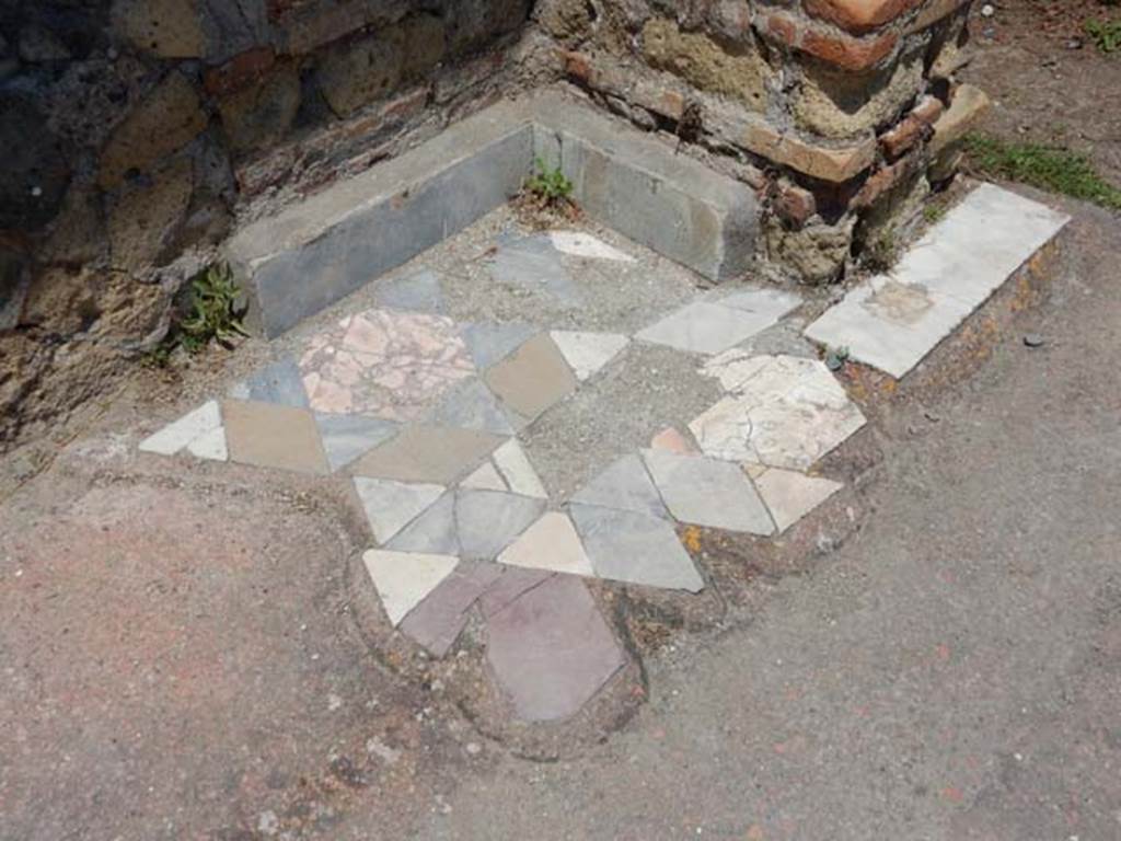 IV.21, Herculaneum. May 2018. Large triclinium 15, flooring in north-west corner. Photo courtesy of Buzz Ferebee. 