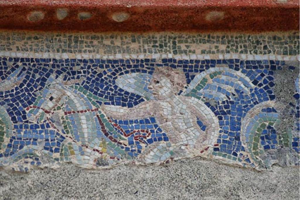IV.21, Herculaneum, April 2018. Garden 32, detail of a cupid from the frieze on the great portal. Photo courtesy of Ian Lycett-King. Use is subject to Creative Commons Attribution-NonCommercial License v.4 International.
