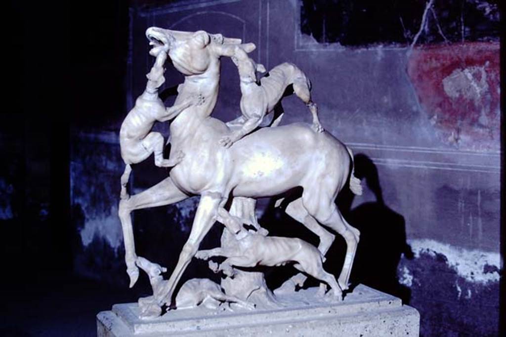 IV.21, Herculaneum. 1968. Statue of deer being attacked by hounds, on display in a room of the house. Photo by Stanley A. Jashemski.
Source: The Wilhelmina and Stanley A. Jashemski archive in the University of Maryland Library, Special Collections (See collection page) and made available under the Creative Commons Attribution-Non-Commercial License v.4. See Licence and use details.
J68f1840
