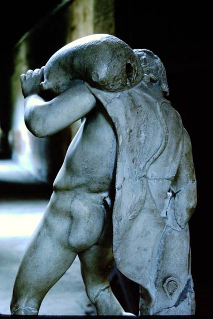 IV.21, Herculaneum. 1964. Satyr with wineskin. Photo by Stanley A. Jashemski. 
Source: The Wilhelmina and Stanley A. Jashemski archive in the University of Maryland Library, Special Collections (See collection page) and made available under the Creative Commons Attribution-Non-Commercial License v.4. See Licence and use details.
J64f1384
