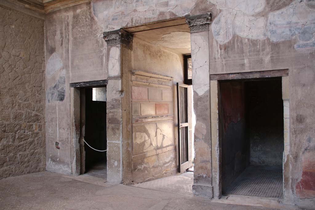 V.1 Herculaneum, April 2014. 
Looking towards west wall of atrium with doorway to room 3, on left, entrance corridor, in centre, and room 2, on right. 
Photo courtesy of Klaus Heese.

