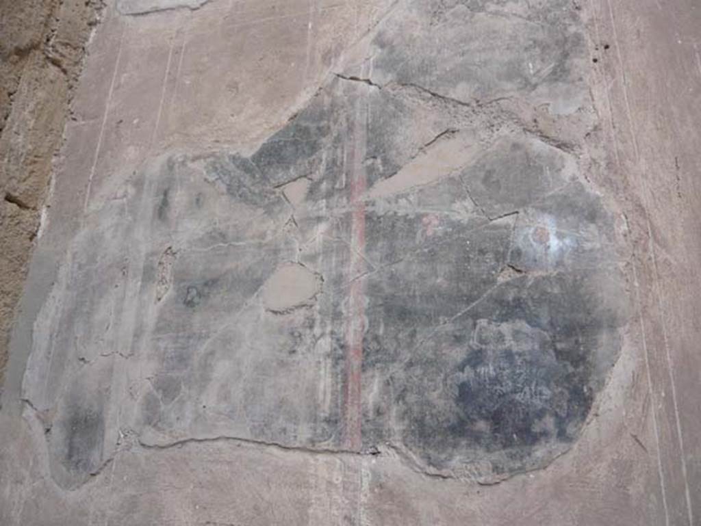 V.1 Herculaneum. August 2013. West wall of atrium, painted decoration from south side of doorway to room 3.  Photo courtesy of Buzz Ferebee.
