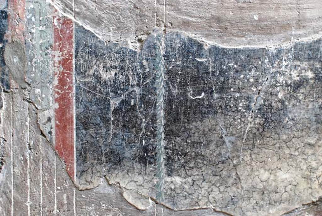 V.1, Herculaneum, November 2008. 
North wall of atrium, detail of remains of painted decoration on west side of doorway to room 9. 
Photo courtesy of Nicolas Monteix.
