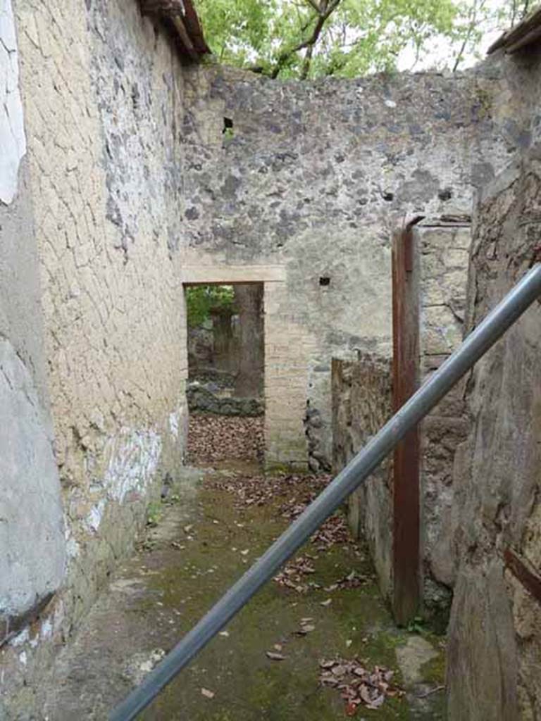 V.4. Herculaneum. May 2010. Looking east past doorway to latrine and storeroom, on right. 

