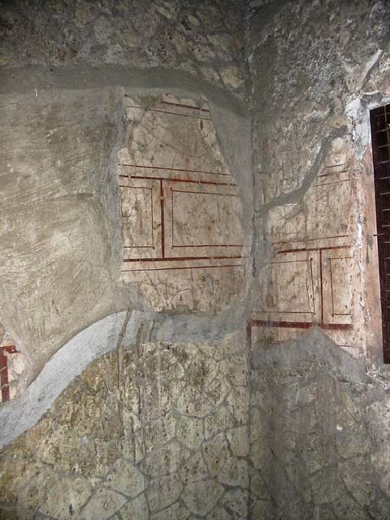 V.8, Herculaneum. May 2003. Room 8, remains of decoration in south-west corner. 
Photo courtesy of Nicolas Monteix.
