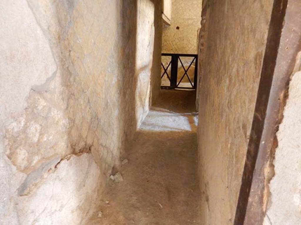 V.8 Herculaneum. May 2018. Looking south along corridor to rooms 9 and 10. Photo courtesy of Buzz Ferebee.   