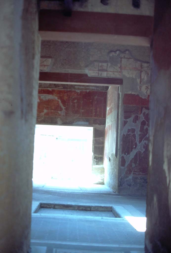 V.15 Herculaneum, 7th August 1976. Looking south from entrance corridor, across atrium to tablinum.
Photo courtesy of Rick Bauer, from Dr George Fay�s slides collection.


