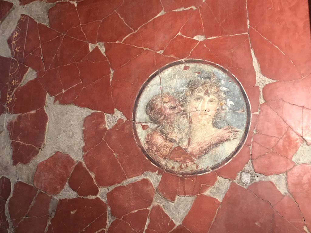 V.15 Herculaneum. October 2019. East wall of tablinum at north end, medallion with painting of an old Silenus and Maenad.
Photograph � Parco Archeologico di Pompei.
