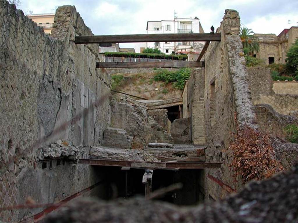 V.15, Herculaneum. September 2003. Looking north along upper west side rooms, from rear.
Note the �so-called cross� on the west wall, centre left.  Photo courtesy of Nicolas Monteix.

