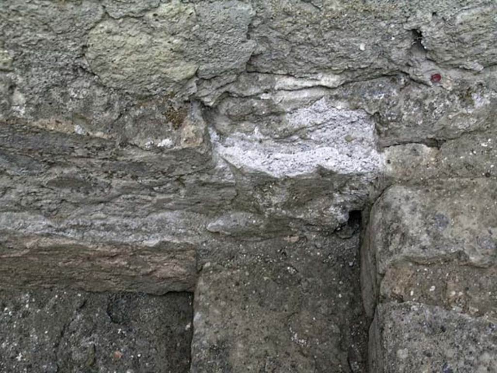 VI.12, Herculaneum. September 2004. West wall above lower sgtep in north-west corner of rear-room. 
Photo courtesy of Nicolas Monteix.
