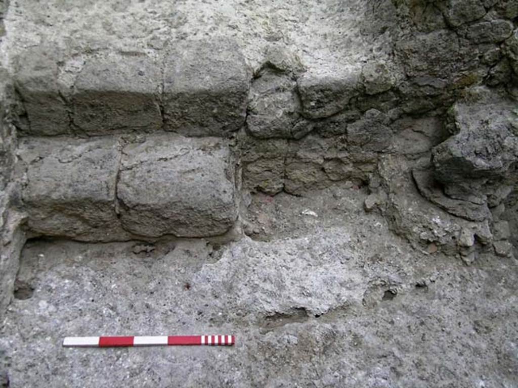 VI.12, Herculaneum. September 2004.  Looking north in north-west corner of rear room, with steps.
Photo courtesy of Nicolas Monteix.
