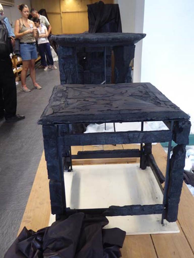VI.29 Herculaneum, September 2016. 
Small wooden table with inlaid top found in this house. Photo courtesy of Michael Binns.
According to Wallace-Hadrill, 
On page 212, there is a photo of this small table with inlaid top, an example of the carbonized wooden furniture found in Herculaneum.
The small table was from this house.
See Wallace-Hadrill, A. (2011). Herculaneum, Past and Future. London, Frances Lincoln Ltd., (p.212).
According to De Carolis, 
This type of furniture had been originally described as a stool in previous studies (44cm high), but was a sella, and from Ins.Or.II.10, and described as a wooden sella with top decorated with a star with 8 points in a veneering technique. 
See De Carolis, E. (2007). Il mobile a Pompei ed Ercolano, letti tavoli sedie e armadi. Rome, �L�ERMA� de Bretsneider, (p.125 fig. 88) 


