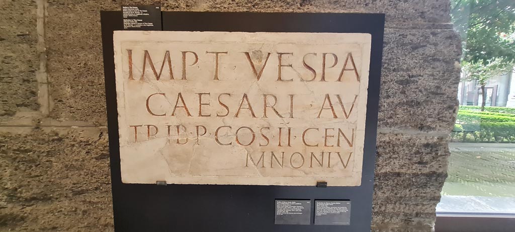 Herculaneum. April 2023. Inscription. Photo courtesy of Giuseppe Ciaramella.
Dedication by Marcus Nonius Balbus for the creation of public works. 
Marcus Nonius Balbus, proconsul, has funded the construction of the Basilica, the city gates and part of the city walls of Herculaneum. The inscription may have been attached to the eastern gate of the city. 
Ercolano (Napoli), presso l'incrocio tra decumano massimo e cardo III (basilica?) (21 mag. - 9 giu. 1739) (inv. 3723)
Imp(eratori) T(ito) Vespa[siano] 
Caesari Au[g(usti) f(ilio)] 
trib(unicia) p(otestate), co(n)s(uli) I̅I̅, cen[s(ori) des(ignato), pont(ifici)] 
M(arcus) Noniu[s ---].      [CIL X 1420]
