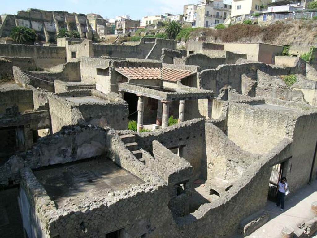 Ins.Or.II. 9/8, Herculaneum. May 2006. Looking north-west from upper floor of Palaestra block towards Insula V on Cardo V.
The doorway to V.30, Casa dell�Atrio corinzio (House of the Corinthian Atrium) is on the right. 
Photo courtesy of Nicolas Monteix.
