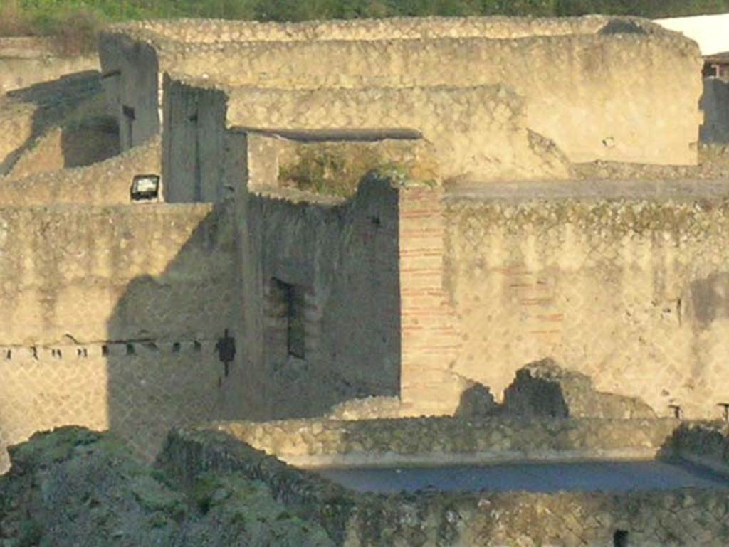 Ins.Or.II. 9/8, Herculaneum. December 2004. Looking north-west from upper floor of Palaestra block across the rooftops of Insula V.
The roof to a room in V.30, Casa dell�Atrio corinzio (House of the Corinthian Atrium) is in the lower right. 
Photo courtesy of Nicolas Monteix
