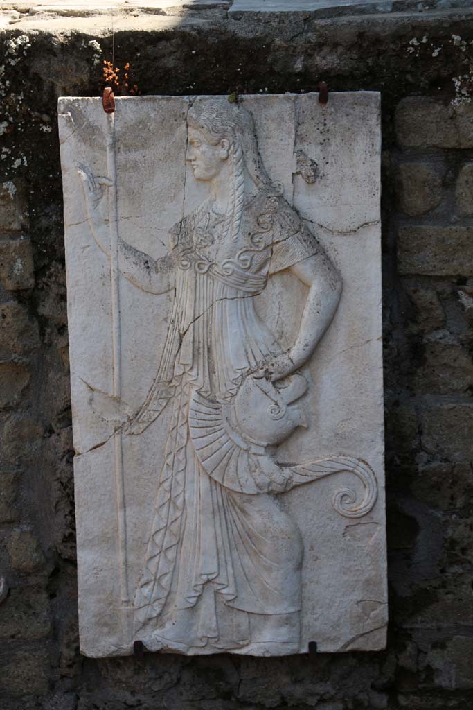 Herculaneum, April 2014. 
Reproduction relief of Minerva from the shrine of Four Gods on the Sacred Area terrace. 
Photo courtesy of Klaus Heese.
