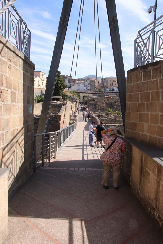Herculaneum, September 2019. Looking north across access bridge towards roadway known as Cardo III Inferiore.
Photo courtesy of Klaus Heese.
