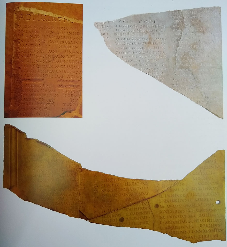 Cardo III, Herculaneum. Detail from Great Album of Names, originally discovered 24th/26th May 1739. 
Top left is a fragment discovered in the eighteenth century; two new fragments found in 1961 are top right.
Below is a join between an old and a new fragment. Photo courtesy of Prof. Andrew Wallace-Hadrill.
Now in Naples Archaeological Museum. Inventory numbers 3728, 3729.
See Wallace-Hadrill, A. (2011). Herculaneum, Past and Future. London, Frances Lincoln Ltd, (p.139).
According to Wallace-Hadrill –
“Numerous fragments with names carefully cut into handsome white marble slabs, emerged from the earliest Bourbon excavations on
26th May and 1st July 1739. Because at the time there were two excavations, at the Theatre and at the ‘new excavations’ (“nuevas grutus” in Spanish) near Via Mare, there was continuous confusion over what came from where, and it was long believed they came from the Theatre.
Only when, at the end of his career, Amedeo Maiuri was exploring the area of the Basilica did three new fragments emerge, one of which matches perfectly an old fragment.”
See Wallace-Hadrill, A. (2011). Herculaneum, Past and Future. London, Frances Lincoln Ltd, (p.138).
