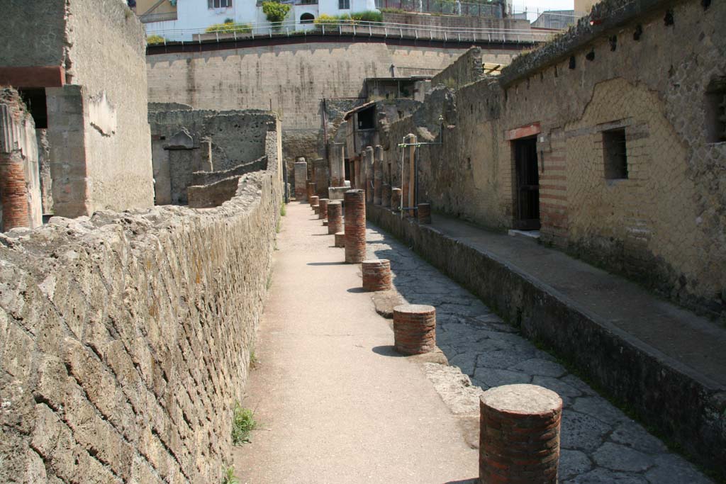 Cardo IV, Herculaneum. April 2011. Looking north along Cardo IV Superiore towards entrance doorway of IV.8, on right.
Photo courtesy of Klaus Heese. 
