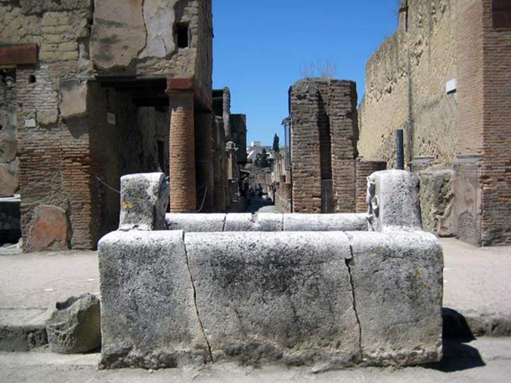Decumanus Maximus, south side, Herculaneum. June 2011. Looking south across fountain of Venus towards junction with Cardo IV. 
Photo courtesy of Sera Baker.


